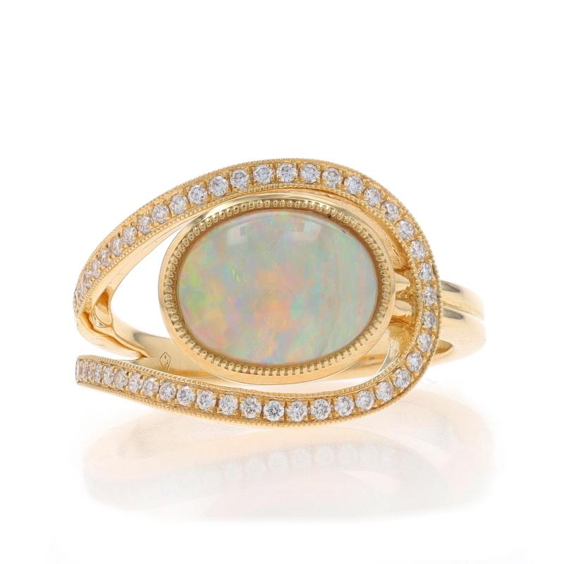 Size: 6 3/4
Sizing Fee: Up 1 1/2 sizes for $60 or Down 1 size for $40

Metal Content: 14k Yellow Gold

Stone Information
Natural Opal
Carat(s): 1.88ct
Cut: Oval Cabochon
Stone Note: Australian

Natural Diamonds
Carat(s): .21ctw
Cut: Round