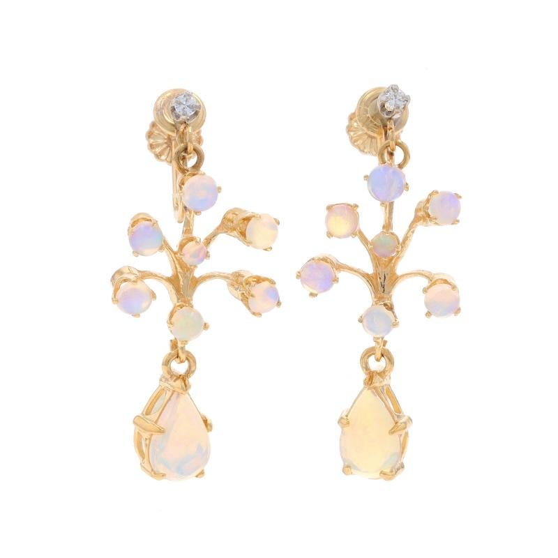 Era: Vintage

Metal Content: 14k Yellow Gold & 14k White Gold

Stone Information
Natural Opals
Carat(s): 2.46ctw
Cut: Pear Cabochon & Round Cabochon

Natural Diamonds
Carat(s): .06ctw
Cut: Round Brilliant
Color: G - H
Clarity: SI1

Total Carats: