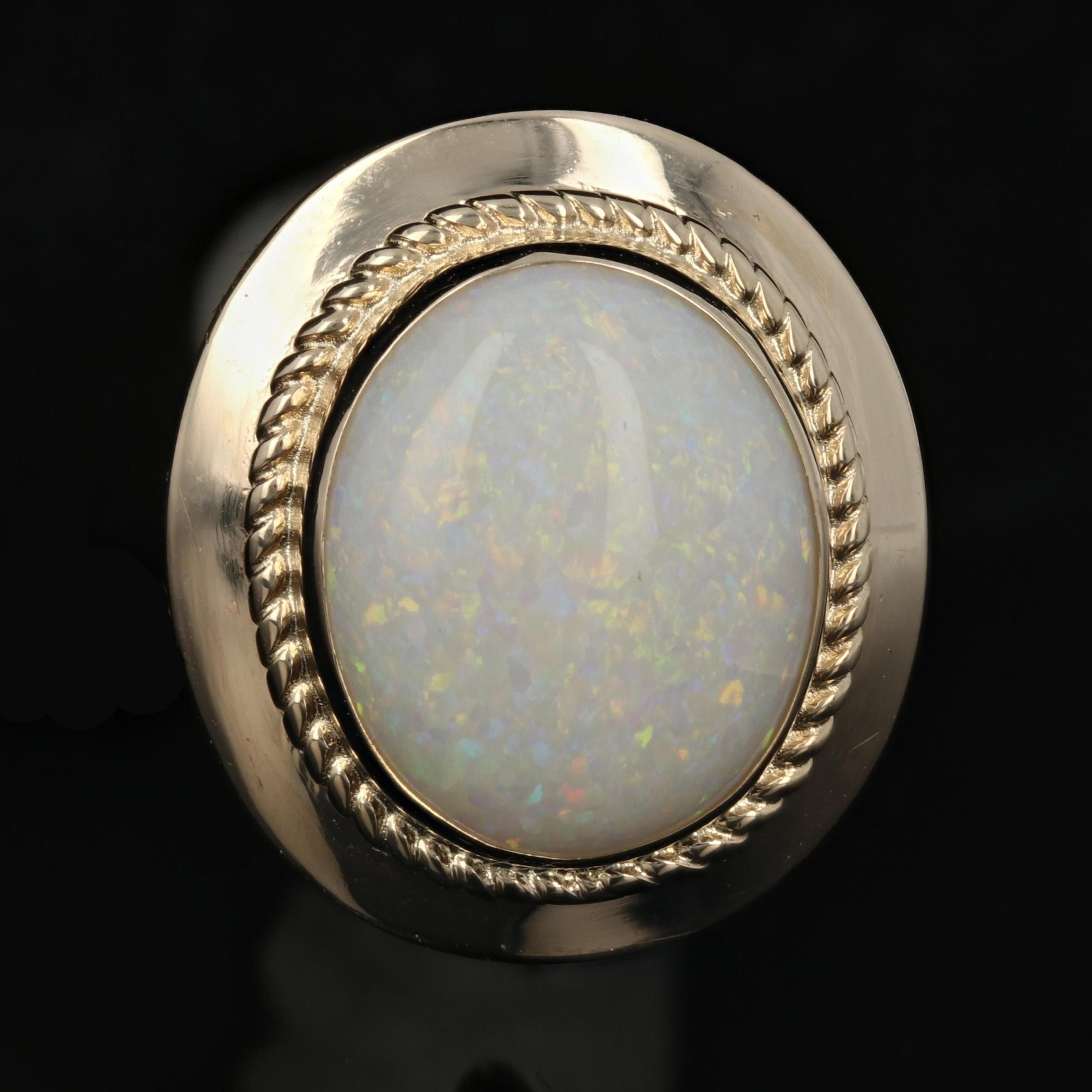 Metal Content: Guaranteed 14k Gold as stamped

Stone Information: 
Genuine Opals
Cut: Oval Cabochon
Total Carat(s): 6.20ctw

Measurements: 
Tall: 23/32