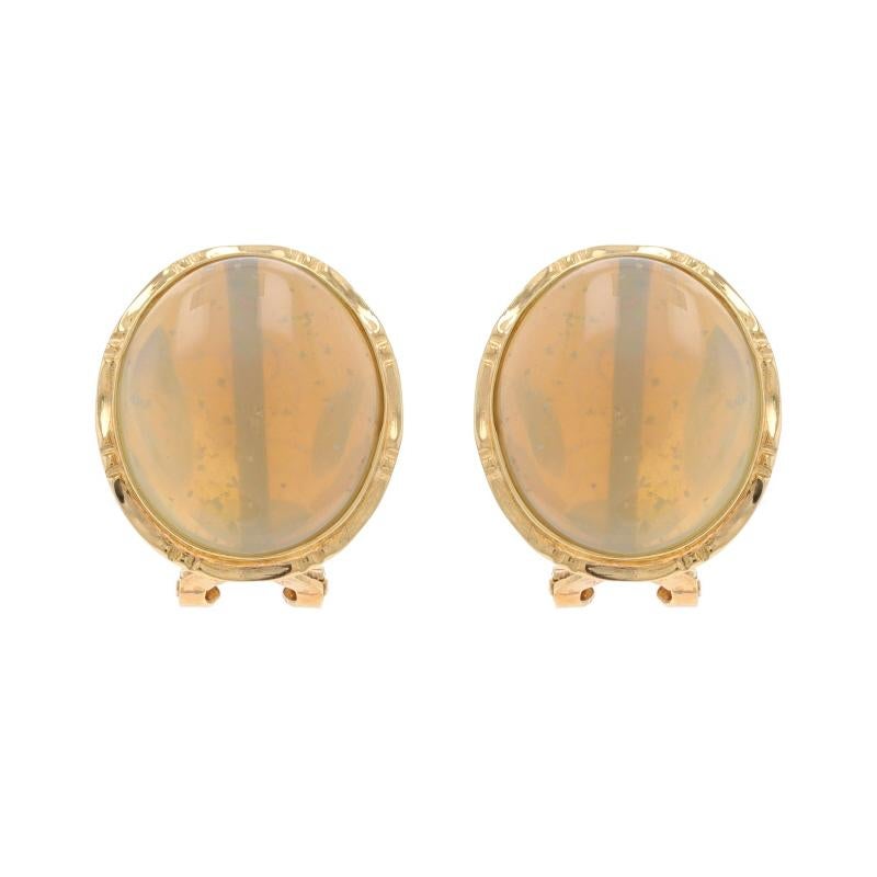 Metal Content: 14k Yellow Gold

Stone Information

Natural Opals
Cut: Oval Cabochon
Origin: Ethiopian

Style: Large Stud
Fastening Type: Omega Closures

Measurements

Tall: 11/16