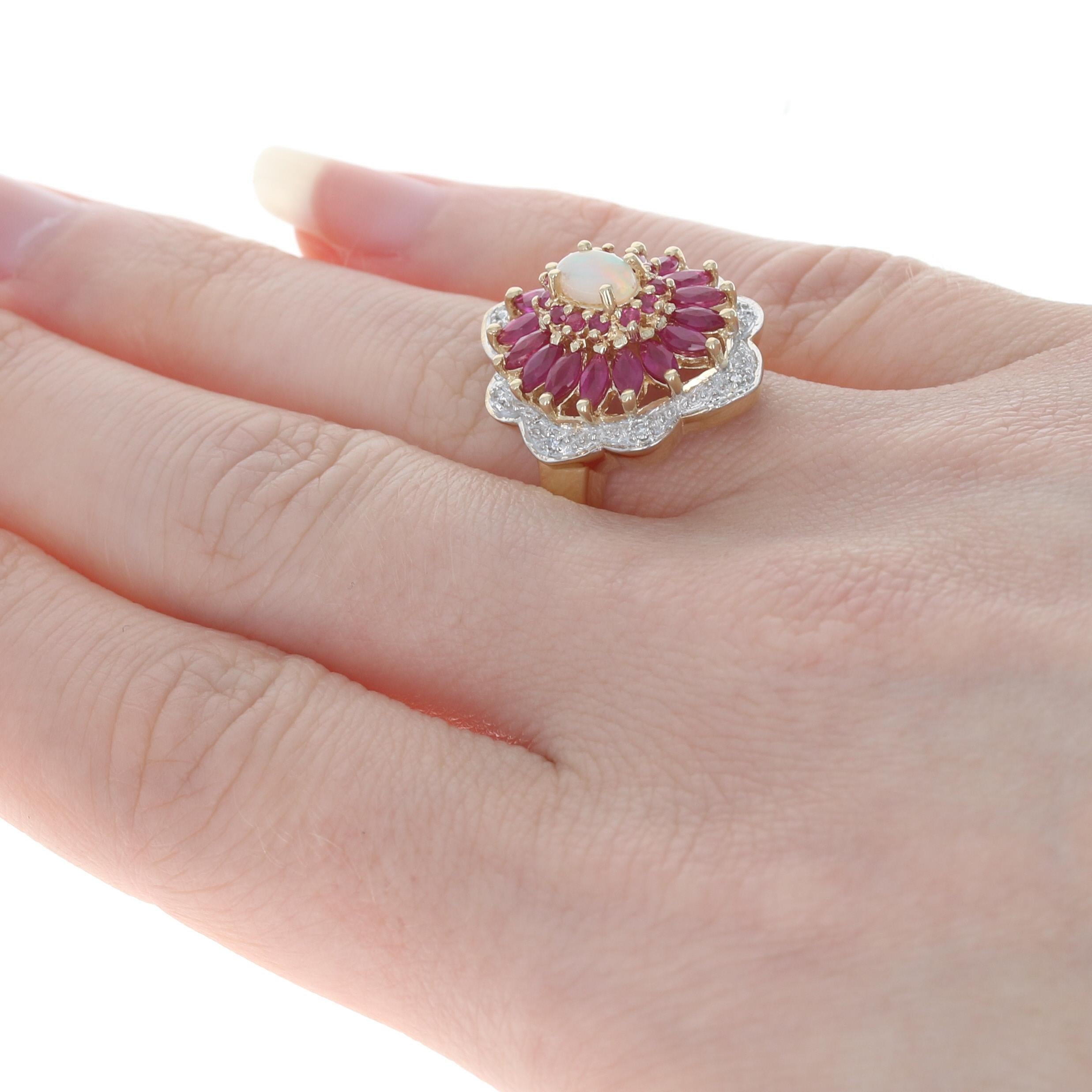 Yellow Gold Opal, Ruby, & Diamond Flower Halo Ring, 10k Oval Cut 2.78ctw In Excellent Condition In Greensboro, NC