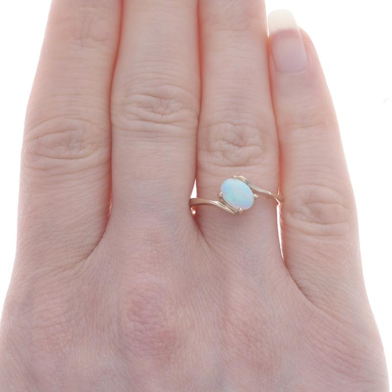 Gelbgold Opal Solitär Bypass Ring - 10k Oval Cabochon 0,35ct (Ovalschliff)