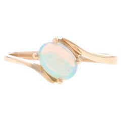 Gelbgold Opal Solitär Bypass Ring - 10k Oval Cabochon 0,35ct