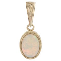 Yellow Gold Opal Solitaire Pendant, 14 Karat Oval Cabochon Cut .61ct  Milgrain