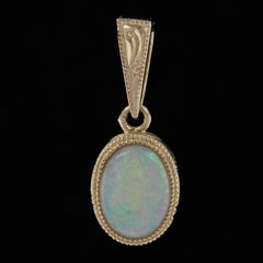 Yellow Gold Opal Solitaire Pendant, 14 Karat Oval Cabochon Cut .61ct  Milgrain