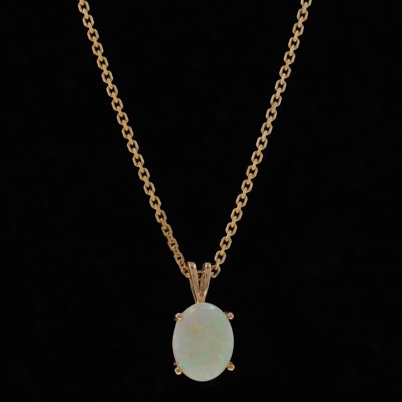 Metal Content: 14k Yellow Gold

Stone Information
Natural Opal
Carat(s): 1.55ct
Cut: Oval Cabochon
Origin: Australia

Total Carats: 1.55ct

Style: Solitaire
Chain Style: Diamond Cut Cable
Necklace Style: Chain
Fastening Type: Spring Ring