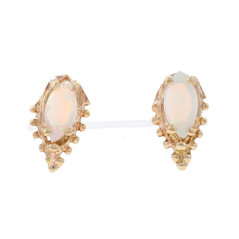 Metal Content: 14k Yellow Gold

Stone Information

Natural Opals
Carat(s): .70ctw
Cut: Marquise Cabochon
Stone Note: Australian

Total Carats: .70ctw

Style: Stud
Fastening Type: Butterfly Closures

Measurements

Tall: 1/2