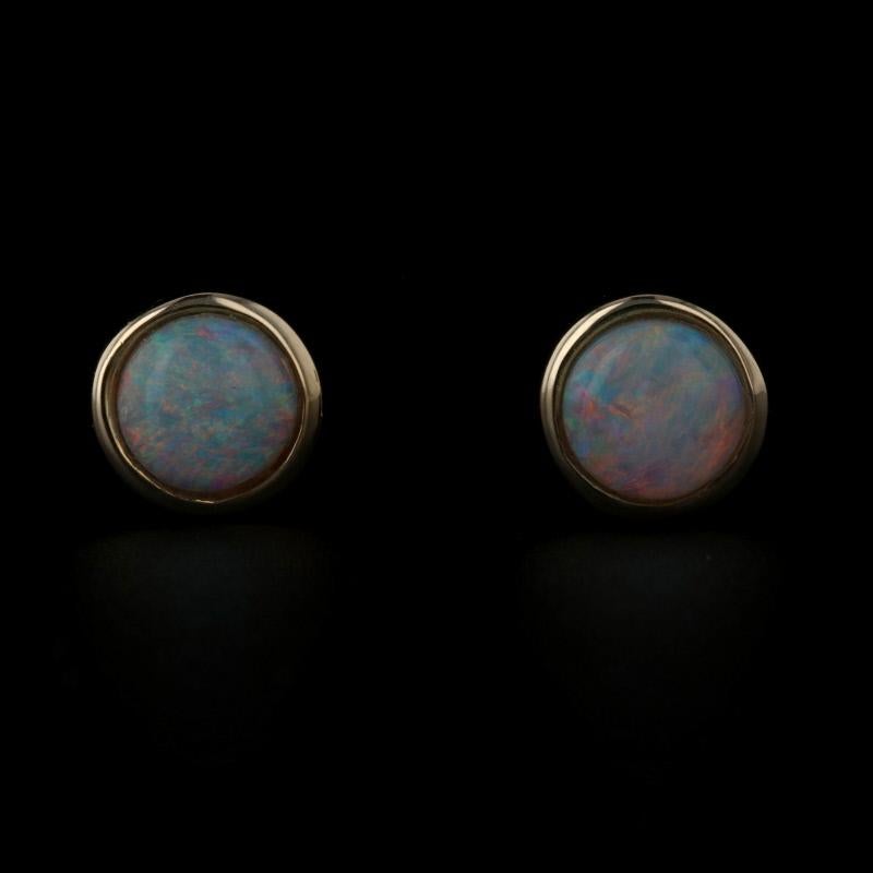 Metal Content: 14k Yellow Gold  

Stone Information: 
Genuine Opals
Total Carats: .51ctw
Cut: Round Cabochon 

Style: Stud 
Fastening Type: Butterfly Closures 

Measurements: 
Tall: 9/32