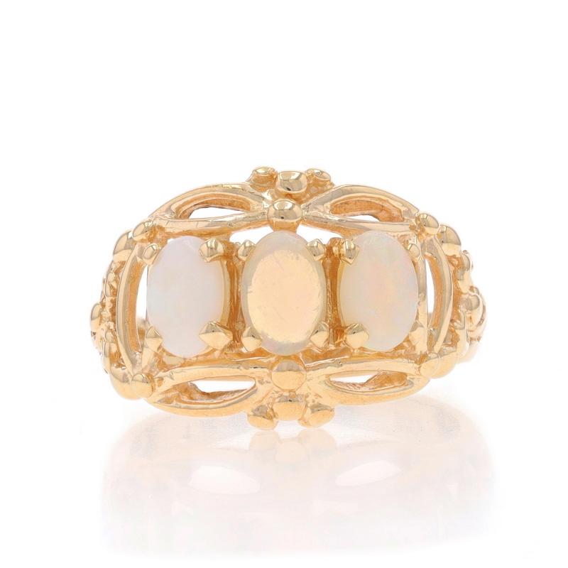 Size: 6
Sizing Fee: Up 2 sizes for $35 or Down 2 sizes for $35

Metal Content: 14k Yellow Gold

Stone Information

Natural Opals
Carat(s): .63ctw
Cut: Oval Cabochon

Total Carats: .63ctw

Style: Three-Stone
Features: Open Cut