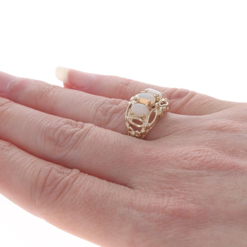 Women's Yellow Gold Opal Three-Stone Ring - 14k Oval Cabochon .63ctw For Sale