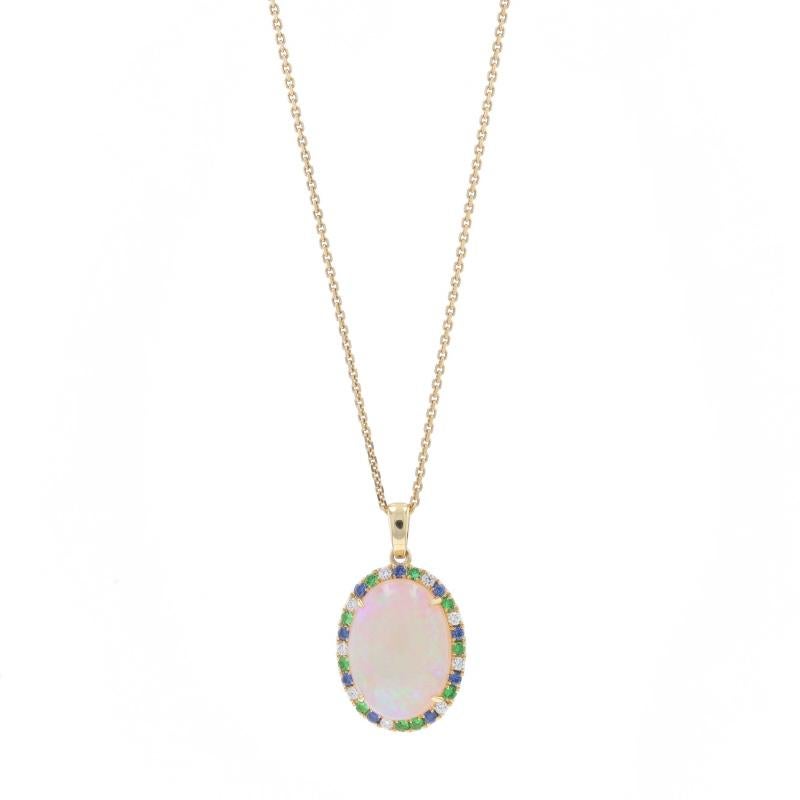 Contenu du métal : Or jaune 14k

Informations sur les pierres
Opale naturelle
Carat(s) : 4.11ct
Coupe : Cabochon ovale
Origine : Australie

Grenats Tsavorite Naturels
Carat(s) : .18ctw
Coupe : Ronde
Couleur : Vert

Saphirs naturels
Traitement :
