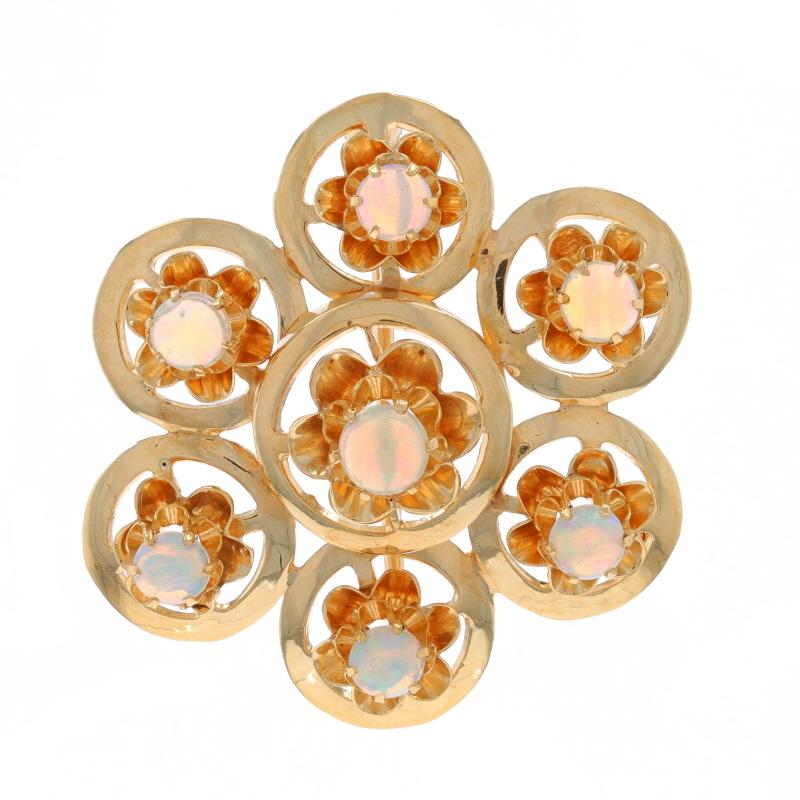 Époque : Vintage

Contenu du métal : Or jaune 14k

Informations sur les pierres

Opales naturelles
Carat(s) : .91ctw
Coupe : Cabochon rond
Origine : Australie

Total des carats : 0.91ctw

Style : Broche
Type de fixation : A.I.C.C. à charnière et