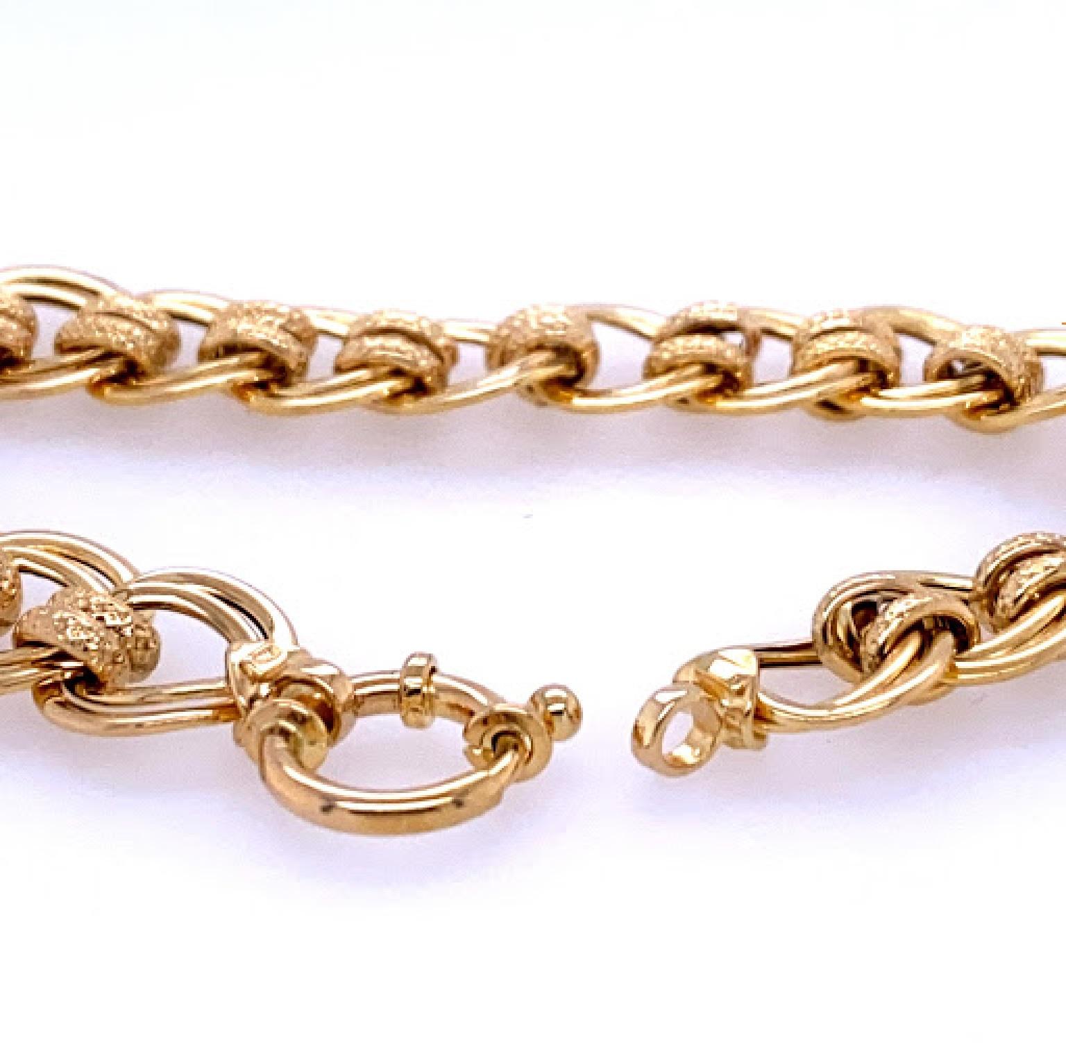 14 karat yellow gold (stamped 585), 8’’ long open double circle link bracelet. The bracelet measures 12.5 mm wide, and 11.75 mm wide3 at the spring ring clasp.