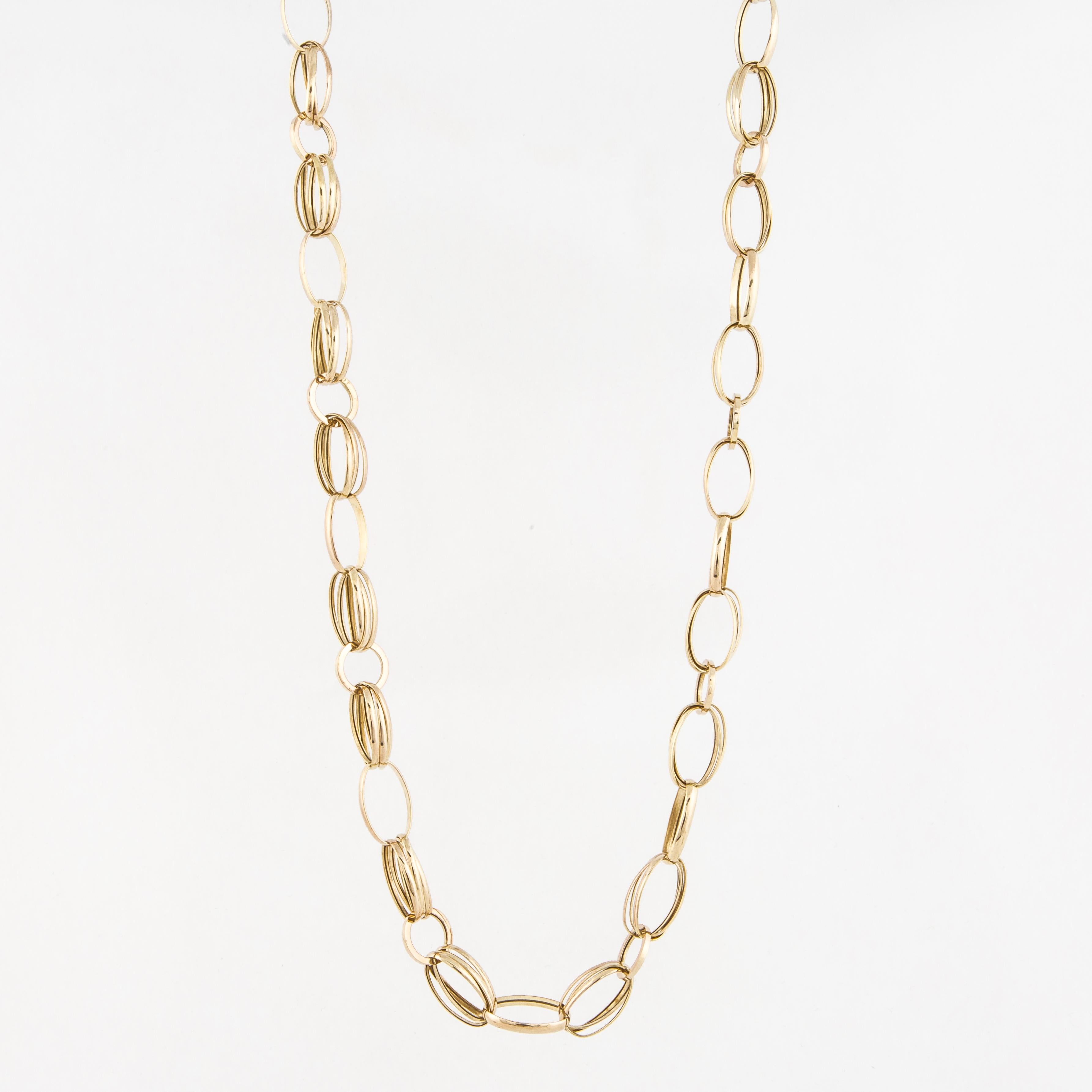 14K yellow gold necklace with oval and round links.  The necklace measures 28 inches long and 7/16 inches wide.