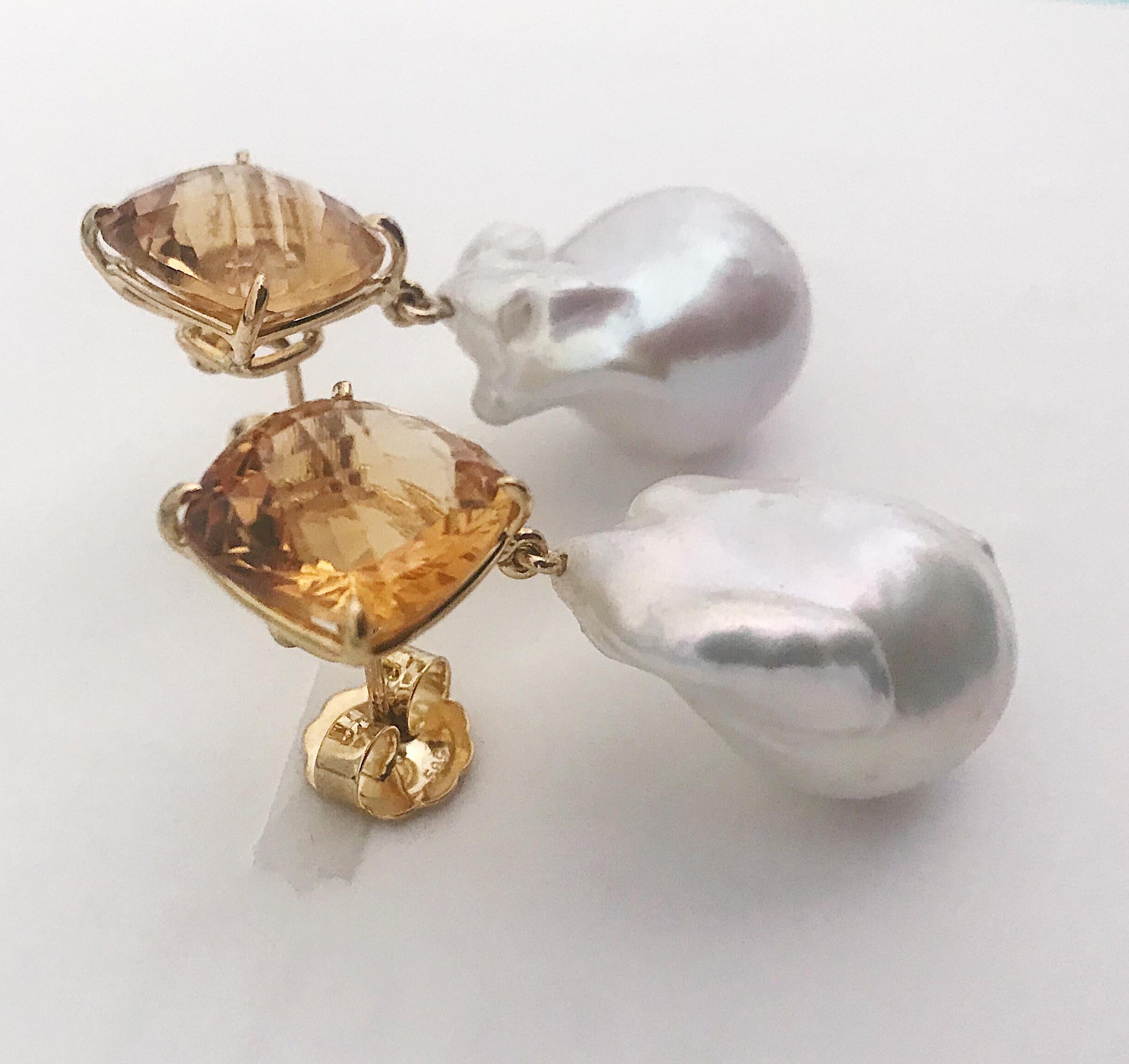 18kt Yellow Gold Square Orange Citrine Stud with a Baroque Freshwater Pearl Drop Earring is a gorgeous statement piece, that is lightweight and versatile. 

The square orange citrine has a checkered board faceting and measures a half of an inch wide