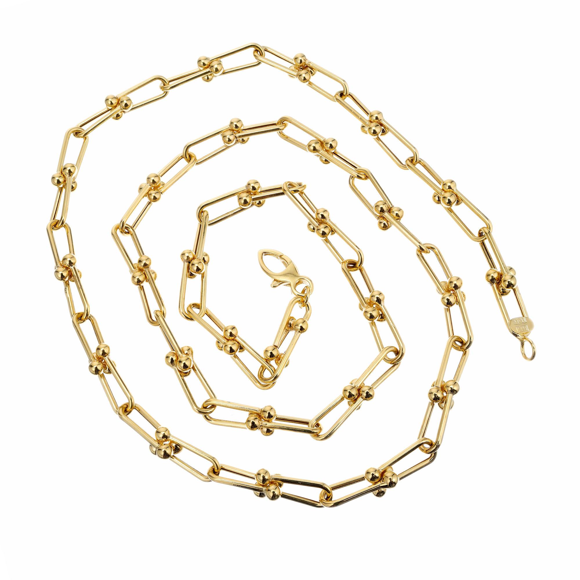 Offene ovale lange Kette aus 14k Gelbgold mit goldenen Kugelenden. Hergestellt in Italien.

14k Gelbgold 
Gestempelt: 14k Italien 
17.1 Gramm
Gesamtlänge: 24 Zoll
Breite: 5,4 - 6,1 mm 
Dicke/Tiefe: 1,3 mm
