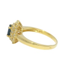 Yellow Gold Oval Cut Sapphire & Diamond Cluster Halo 18-Karat Ring In Stock