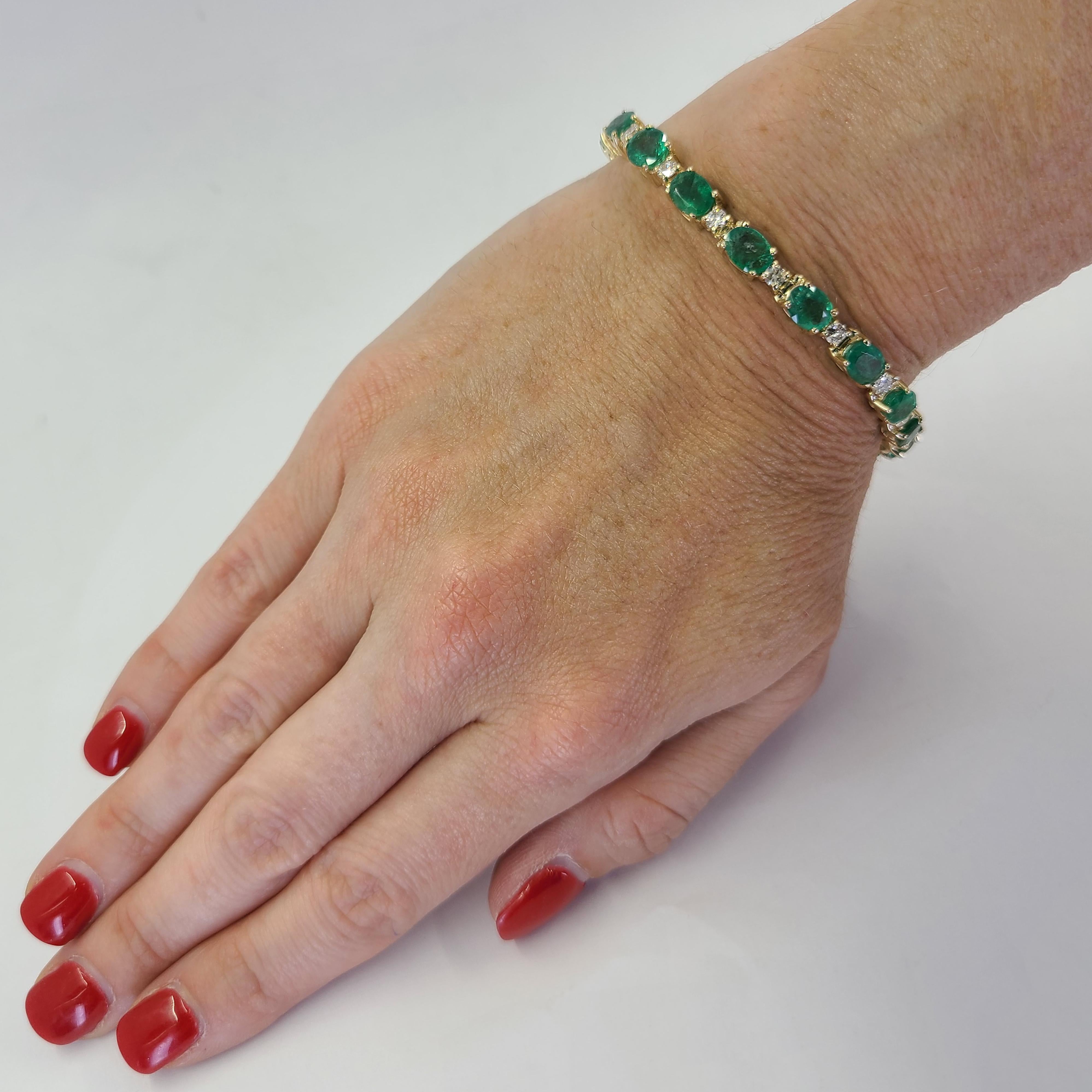14 Karat Yellow Gold Bracelet Featuring 17 Oval Cut Emeralds Totaling Approximately 13.00 Carats and 17 Round Brilliant Cut Diamonds of SI Clarity and H Color Totaling 1.50 Carats. 7 Inch Length with Box Clasp and Figure 8 Safety Clasp. Finished