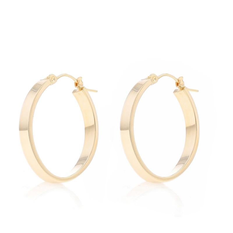 Metal Content: 14k Yellow Gold

Style: Oval Hoop
Fastening Type: Snap Closures
Features: Hollow construction for comfortable, all-day wear

Measurements

Tall: 1 3/32