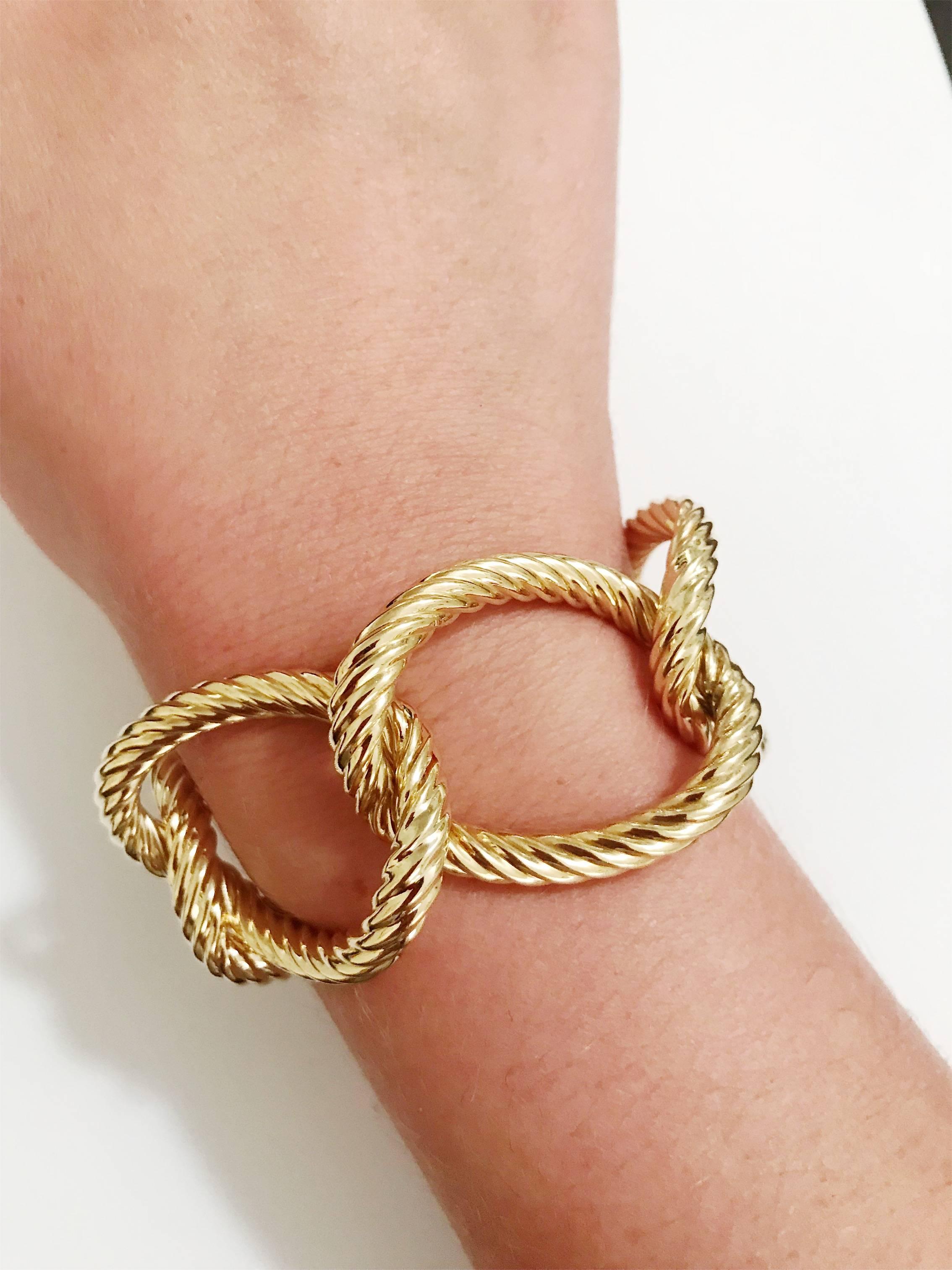 18kt Yellow Gold Oval Spiral Link Bracelet with hinge clasp. Each oval link measures 1 and a half inch wide and 1 and quarter tall.

This bracelet can be made with any color gold and can be sized to any wrist. 

Please let me know if you have any
