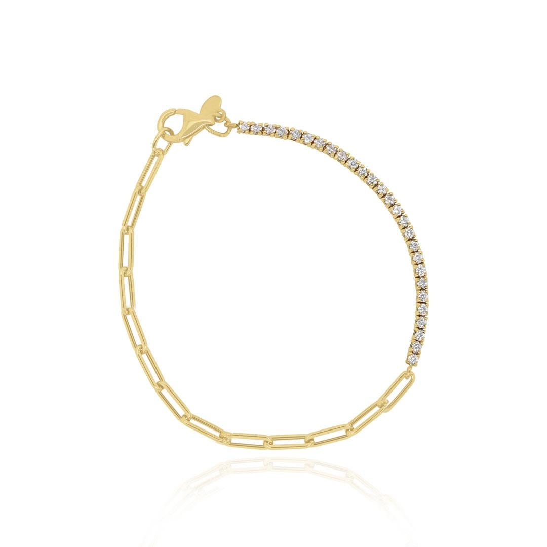 Our half large paperclip bracelet, half diamond tennis bracelet us full of style. Super trendy yet still timeless. Can be made in Blue or Pink Sapphire as well.

14K Yellow Gold
27 Round Diamonds at 0.65 Carats Total Weight
Chain Length: 7 inches or