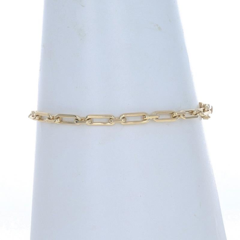 Metal Content: 18k Yellow Gold

Chain Style: Paperclip
Bracelet Style: Chain
Fastening Type: Tab Box Clasp with One Side Safety Clasp

Measurements

Length: 8 3/4