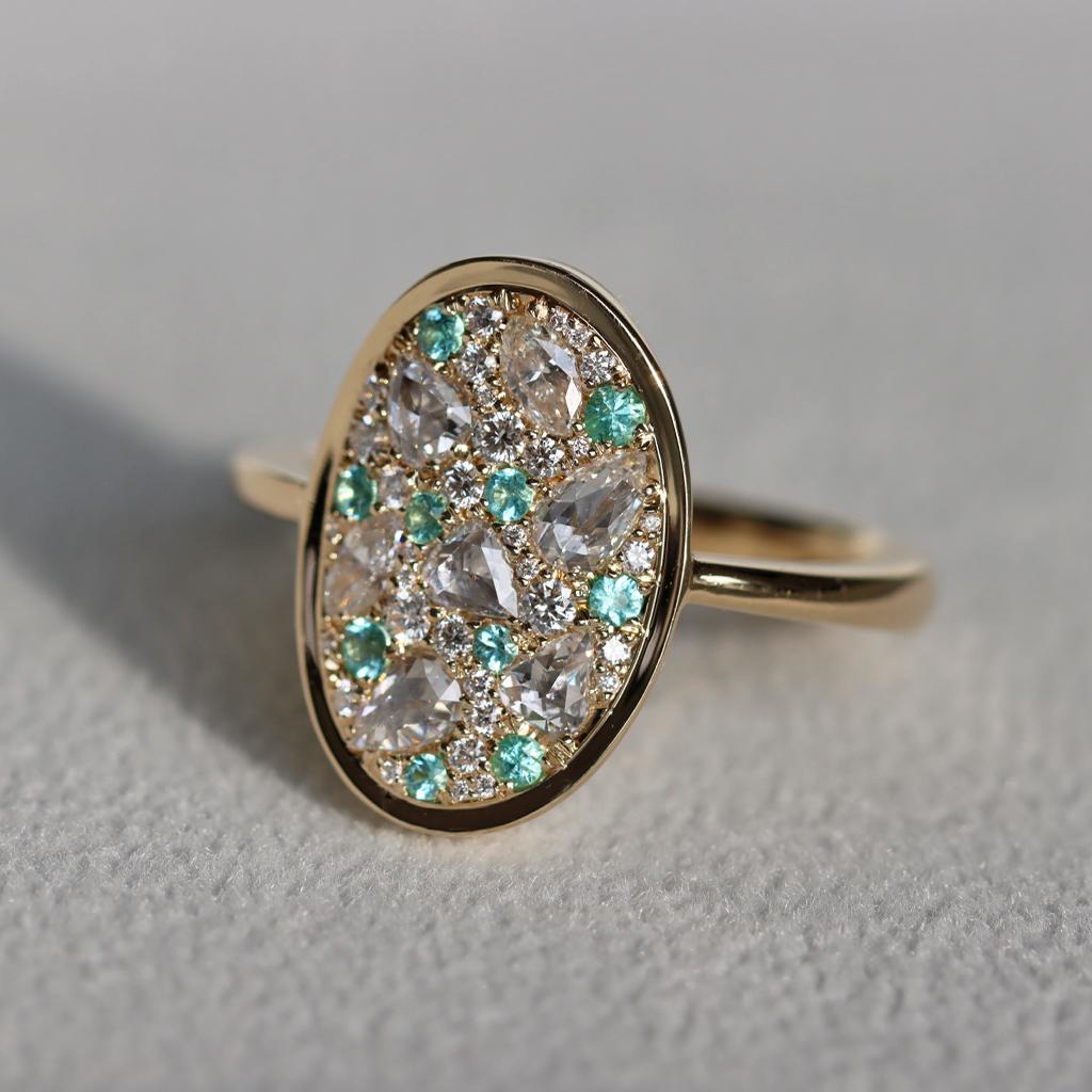 One of a kind Mosaic Pave Ring, handmade in Belgium by jewellery artist Joke Quick. (no casting or printing is involved.)  patiently set with Fancy shape and brilliant-cut diamonds and Brasilian Paraiba Tourmalines.

This low profile and curved ring