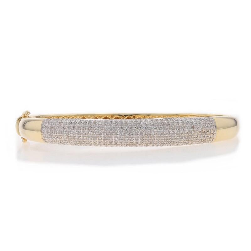 Metal Content: 14k Yellow Gold & 14k White Gold

Stone Information

Natural Diamonds
Carat(s): 1.00ctw
Cut: Single
Color: G - H - I
Clarity: SI1 - I1

Total Carats: 1.00ctw

Style: Cluster Bangle
Fastening Type: Tab Box Clasp with Two Side Safety