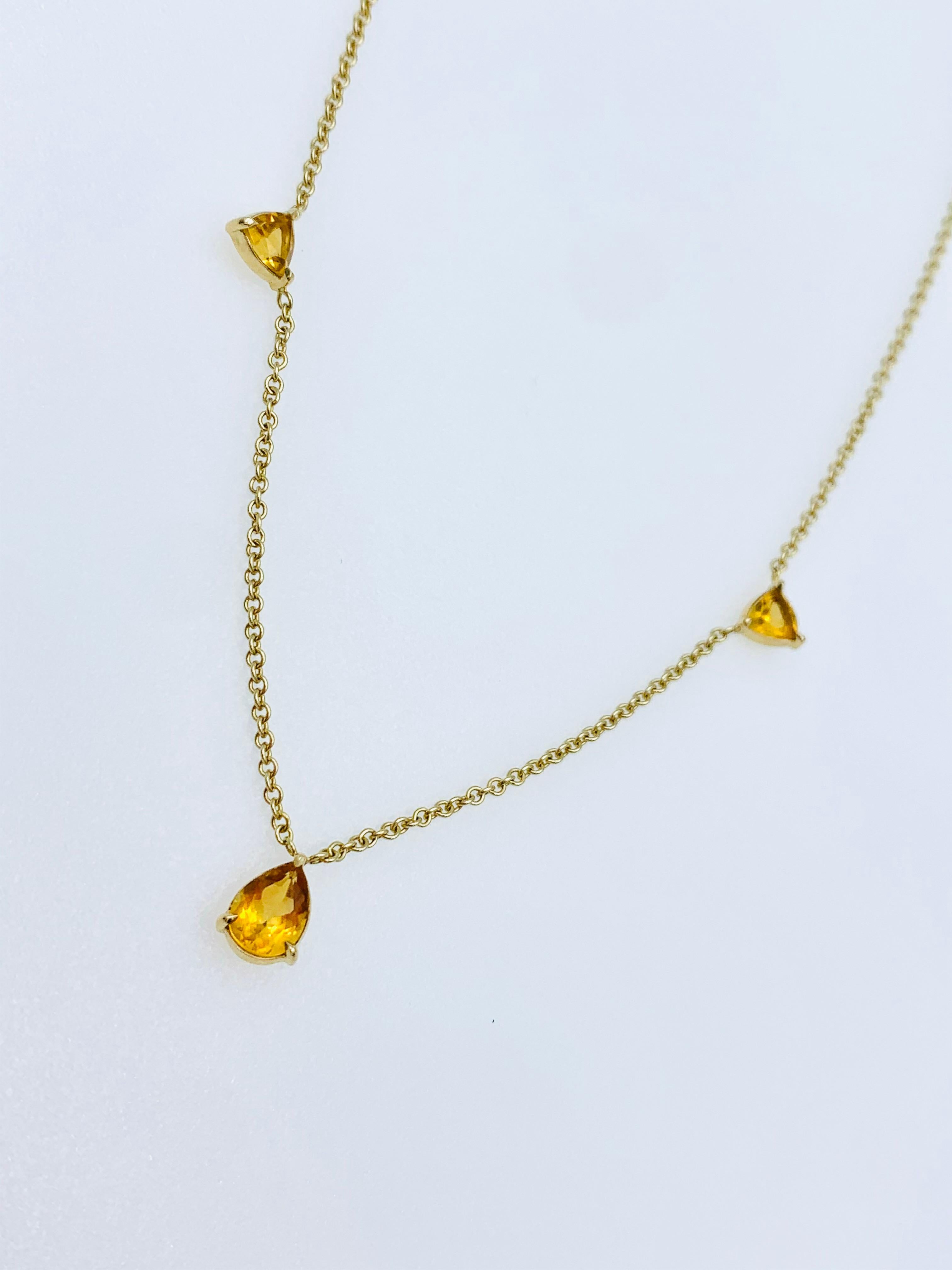 Hand made in 9 karat gold with two trillion cut shaped Citrines to the side and one pear cut shaped Citrine in the middle. It can be worn effortlessly for any occasion at two different lengths 16/15 