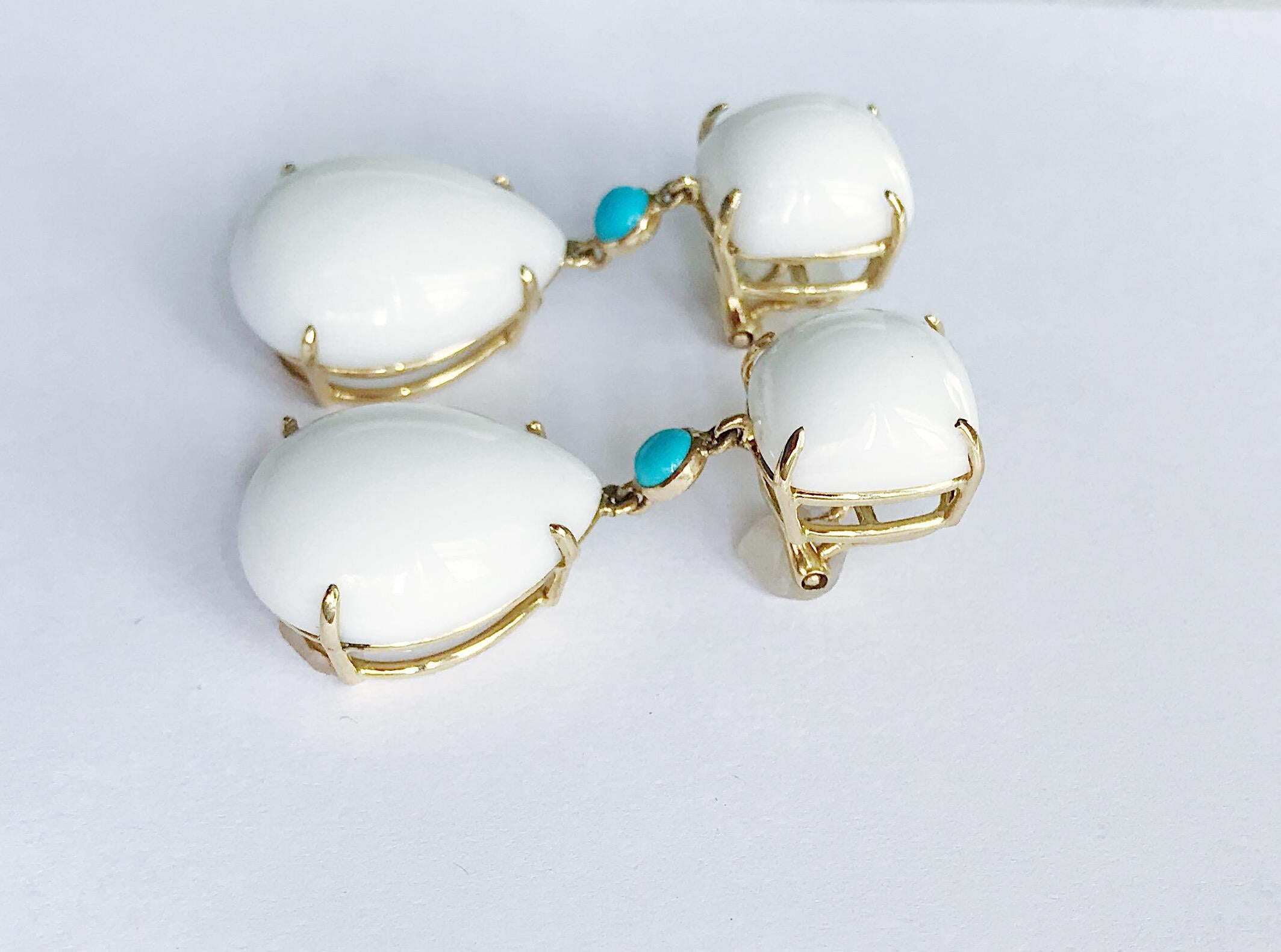 Elegant 18kt Yellow Gold Pear Drop Earring with White Jade and connecting Bezel Set Turquoise Center is an excellent statement piece. 

The meaning measures 1.75 inches tall and 1/2 inch wide.

This Pear Drop earring is available in any color stone