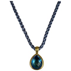 Hammerman Brothers Yellow Gold Pear Shape Blue Topaz Pendant on Silk Cord