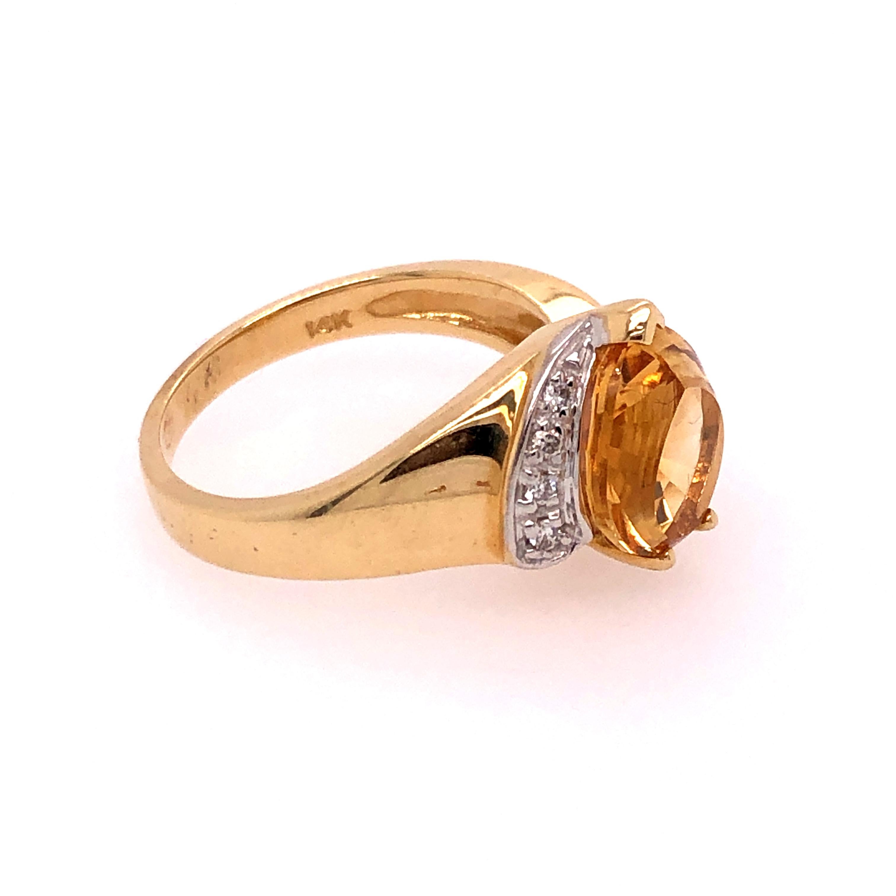 Wear a little bit of sunshine in this fun 14K yellow gold pear shaped citrine and diamond ring! The citrine measures 9 mm x 11 mm and 4 small graduated melee diamonds grace one side of the citrine. 

Size: approximately 6.5 

Stamped: 14K