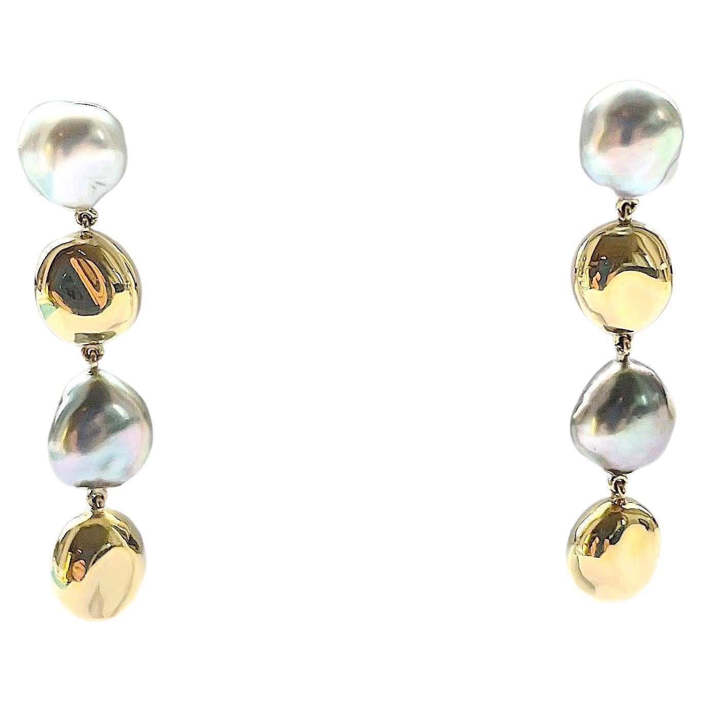 18kt Yellow Gold South Sea Baroque Gray Pearl and Gold bead Drop Earrings by A. Clunn

Beautiful Gray Pearl and Gold Bead alternating drop earring by Andrew Clunn. 

This elegant versatile earring with Four alternating South Sea Baroque Pearls