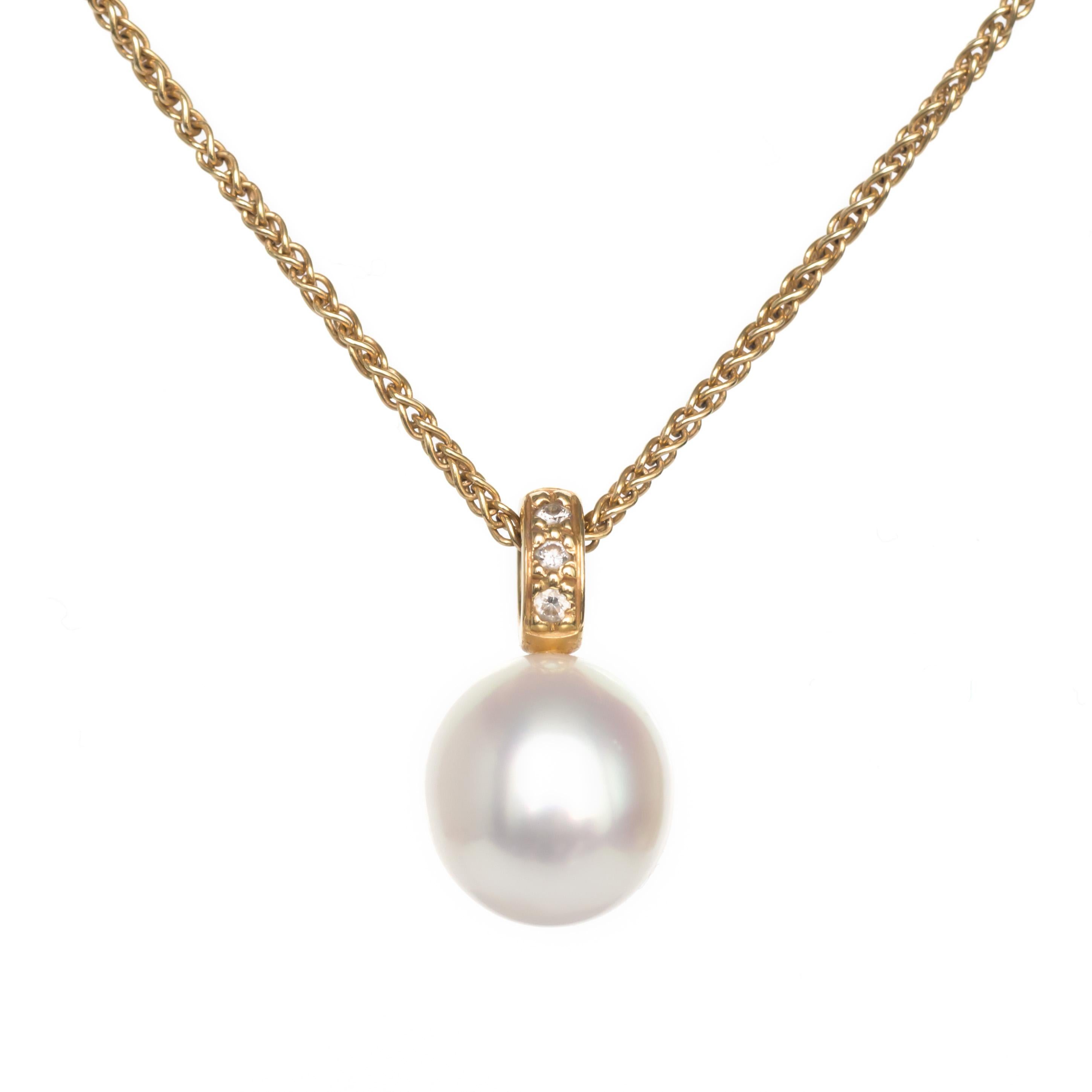 Item Details: 
Metal Type: 18 Karat Yellow Gold
Weight: 7.8 grams

Center Diamond Details:
Cultured Pearl.
AAA Quality.

Side Stone Details: 
Shape: Round Brilliant 
Total Carat Weight: .08 carat total weight
Color: F
Clarity: VS
