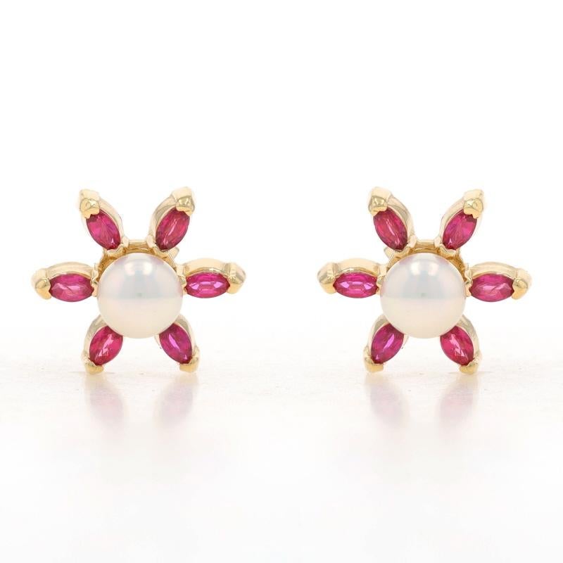 Metal Content: 14k Yellow Gold & 14k White Gold

Stone Information
Cultured Pearls
Color: White
Diameter: 6.1mm

Natural Rubies
Treatment: Heating
Carat(s): .60ctw
Cut: Marquise
Color: Pinkish Red

Total Carats: .60ctw

Style: Studs with Removable