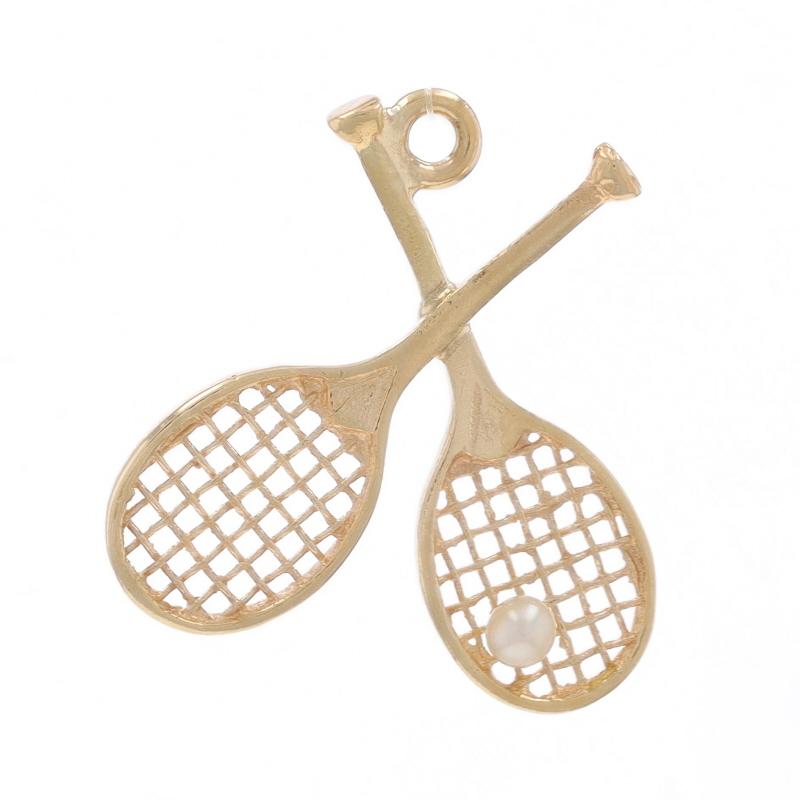 Metal Content: 14k Yellow Gold

Stone Information

Cultured Pearl

Theme: Tennis Rackets & Ball, Sports Recreation

Measurements

Tall (from stationary bail): 13/16