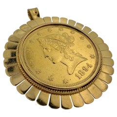 Yellow Gold Pendant and Brooche with Ten Dollars Coin