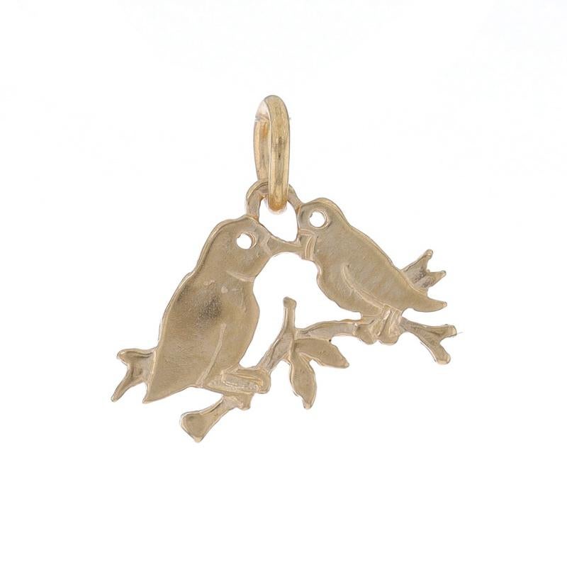 Metal Content: 14k Yellow Gold

Theme: Perching Love Birds
Features: Open Cut Detailing

Measurements

Tall (from stationary bail): 3/8