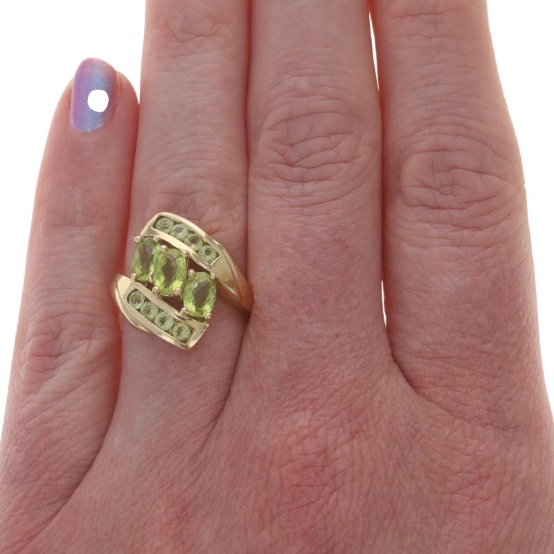 Size: 6 3/4
Sizing Fee: Up 2 sizes for $40 or Down 1 size for $30

Metal Content: 10k Yellow Gold

Stone Information

Natural Peridot
Carat(s): 2.10ctw
Cut: Cushion Checkerboard

Natural Peridot
Carat(s): .64ctw
Cut: Round

Total Carats: