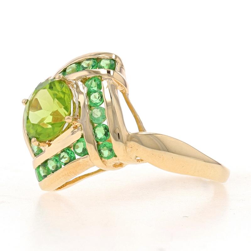 Size: 7

Metal Content: 14k Yellow Gold

Stone Information
Natural Peridot
Carat(s): 1.25ct
Cut: Round
Color: Green

Natural Chrome Diopside
Carat(s): .80ctw
Cut: Round
Color: Green

Total Carats: 2.05ctw

Style: Solitaire with Accents