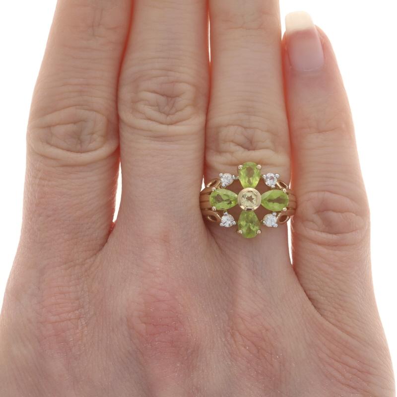 Size: 4 3/4
Sizing Fee: Up 2 sizes for $35 or Down 1 size for $30

Metal Content: 14k Yellow Gold

Stone Information
Natural Peridot
Carat(s): 1.80ctw
Cut: Pear
Color: Green

Natural Citrine
Treatment: Heating
Carat(s): .15ct
Cut: Round
Color: