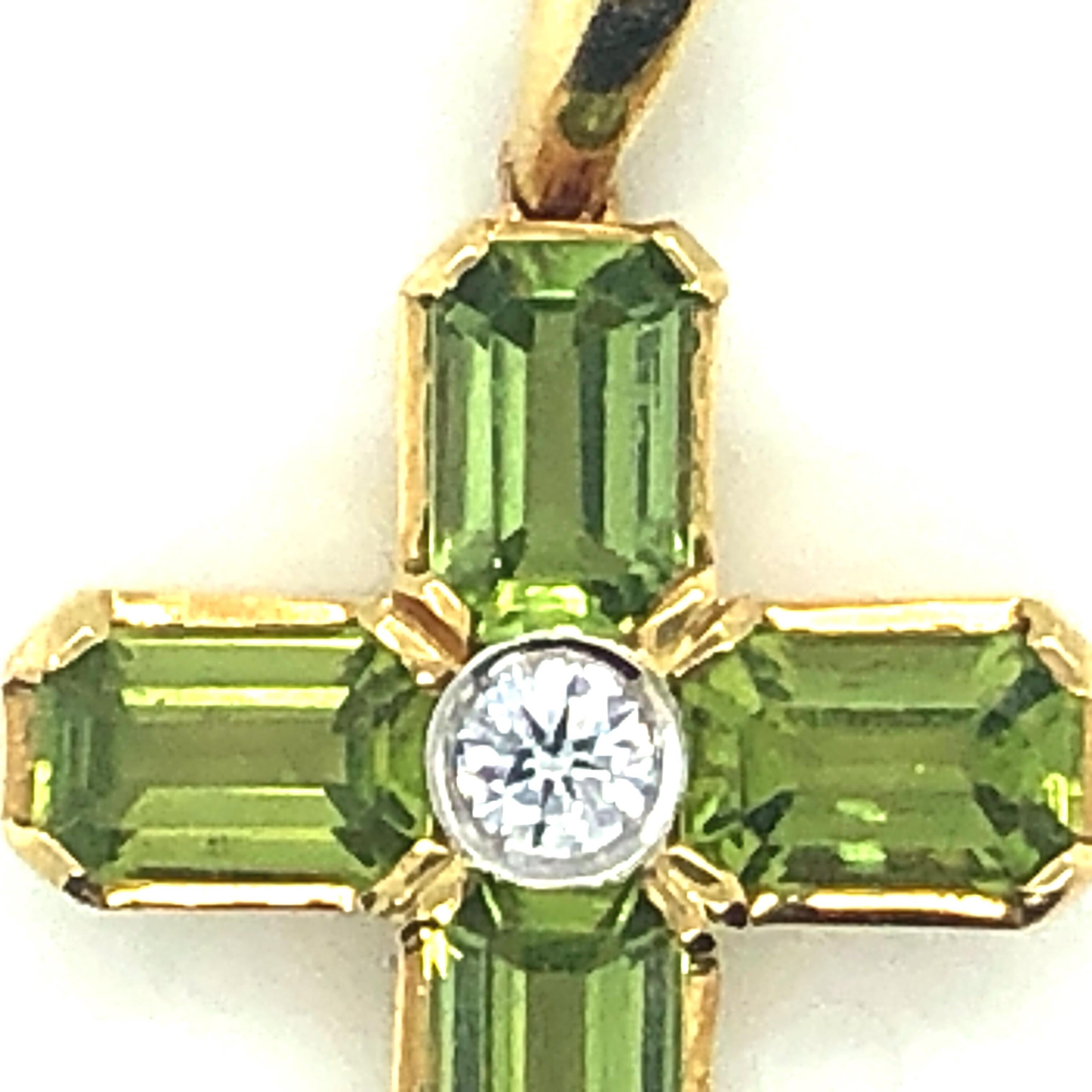 18K Yellow Gold Peridot and Diamond Cross Pendant.  Stamped 750 and 18K. Chain not included. 