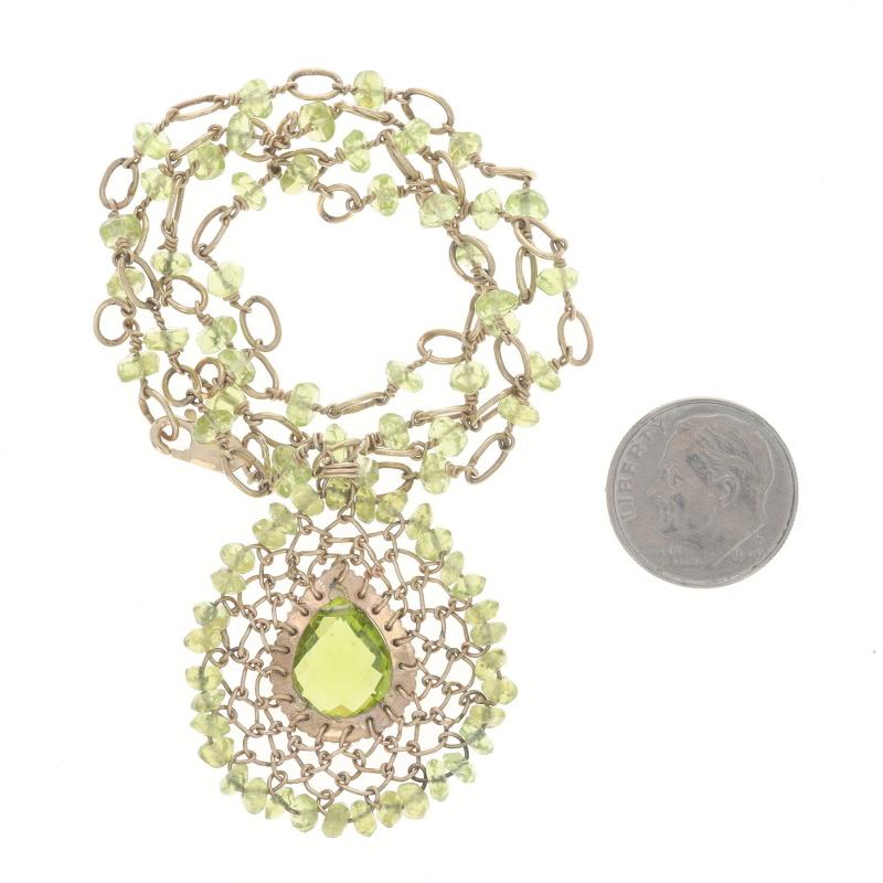 Collana aureola in oro giallo con peridoto da 19
