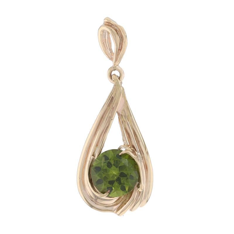 Metal Content: 14k Yellow Gold

Stone Information

Natural Peridot
Carat(s): 1.70ct
Cut: Round
Color: Green

Total Carats: 1.70ct

Style: Solitaire
Theme: Teardrop Twist

Measurements

Tall: 1 9/32