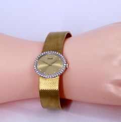 Piaget-Uhr aus Gelbgold mit Diamantlünette und Diamantmarkierungen