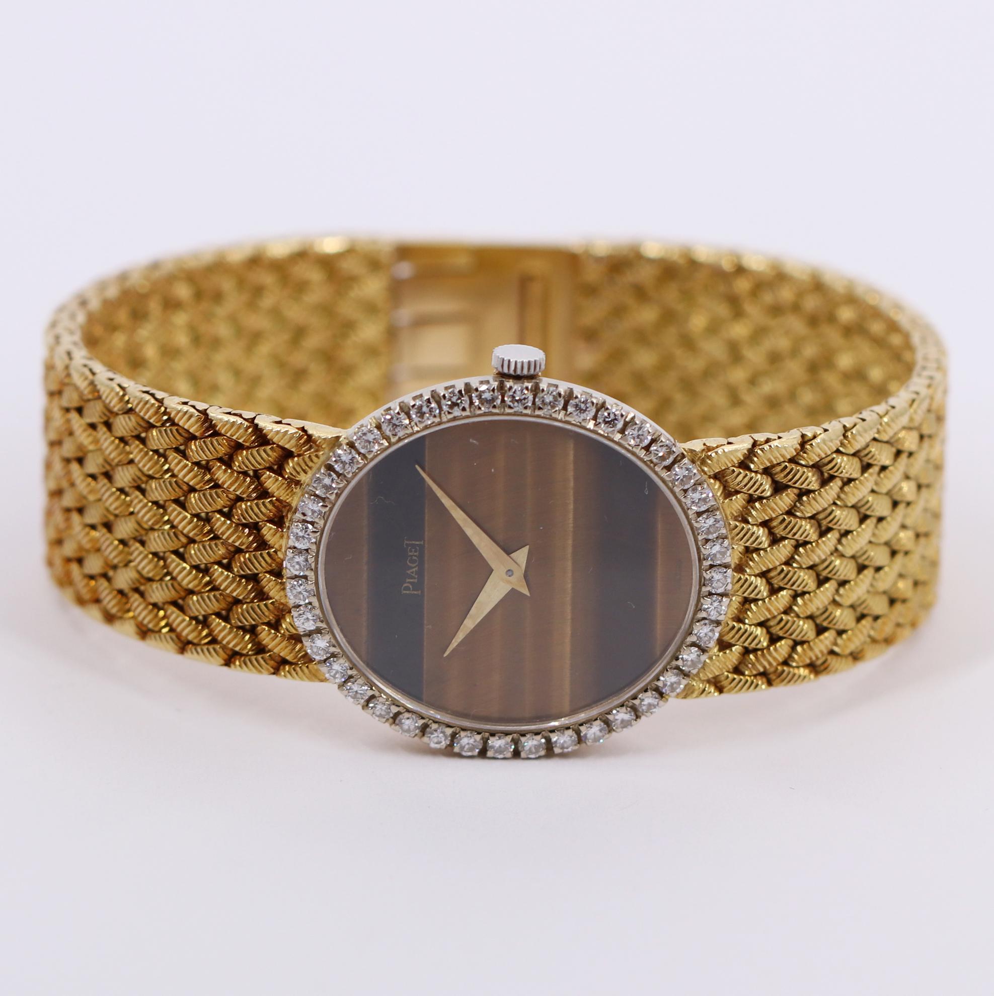 Women's Yellow Gold Piaget Watch with Diamond Bezel and Oval Tiger's Eye Dial