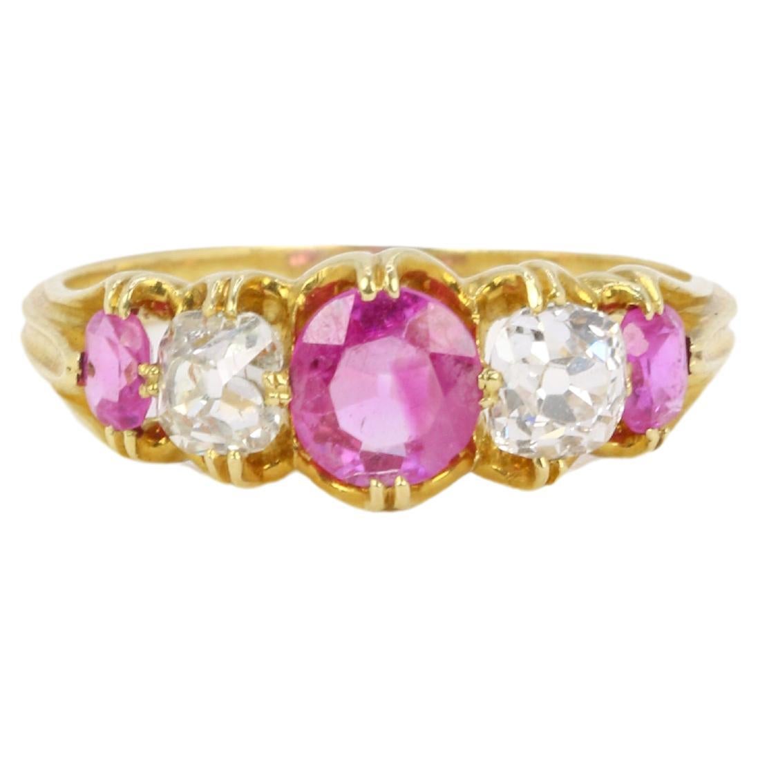 Yellow gold, pink sapphires and old mine cut diamonds garter ring For Sale