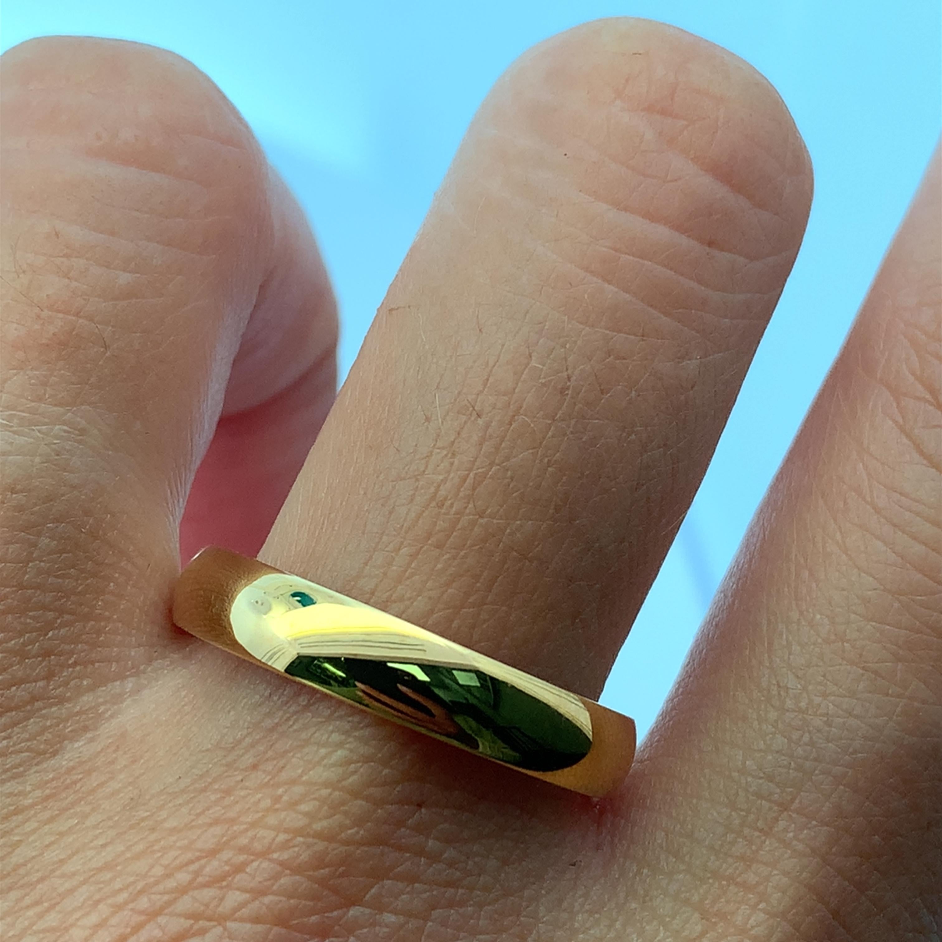 This classic band ring showcases the warm allure of 9k yellow gold. Crafted from a lustrous gold alloy, the ring 4mm, weight 4g features a sleek, minimalist design, making it a versatile addition to any jewelry collection. Its timeless appeal and