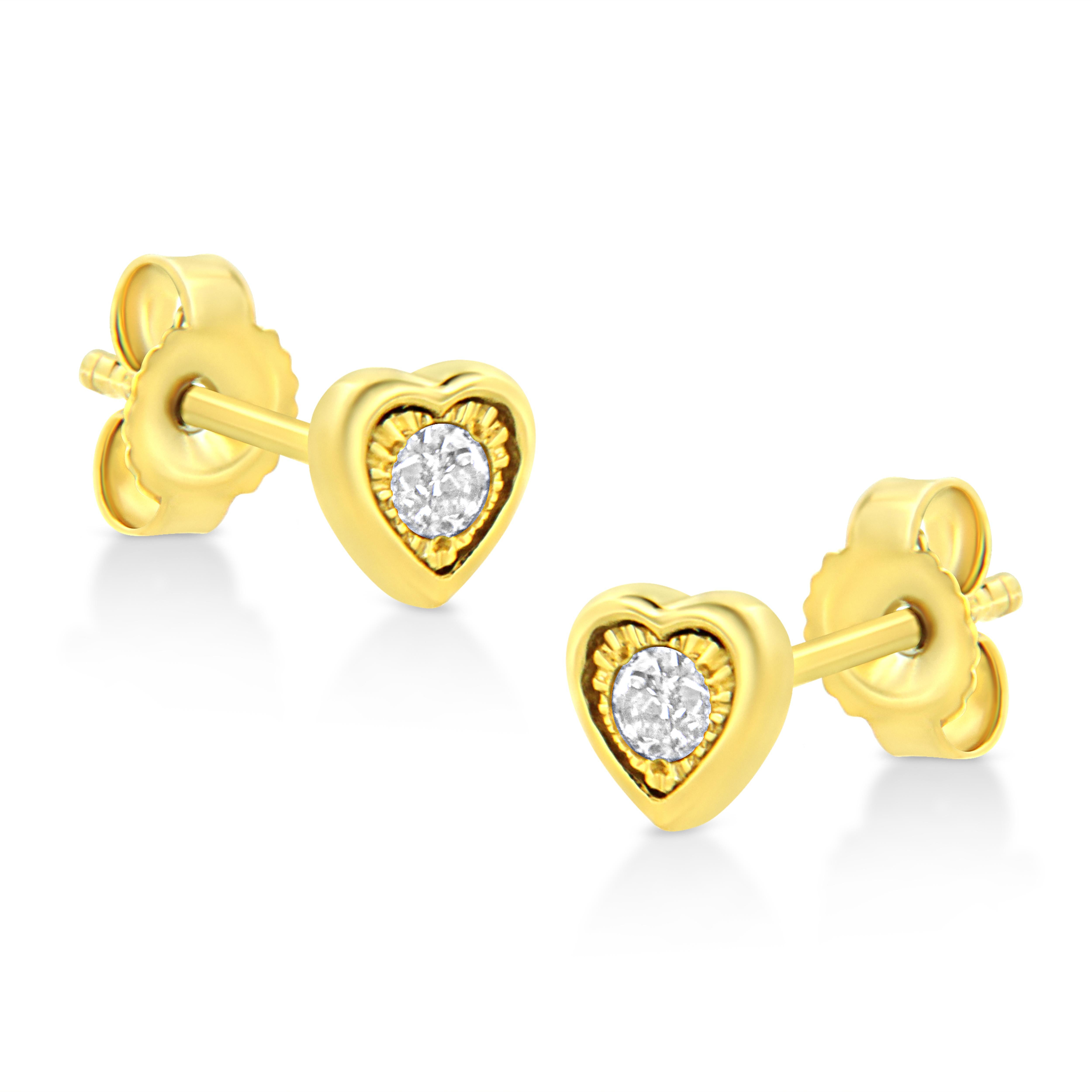 These heart shaped stud earrings are crafted in 10k yellow gold plated sterling silver and feature 1/10ct TDW of diamonds. Each earring features a single sparkling round cut diamond in a miracle setting that adds to the earrings sparkle. A polished