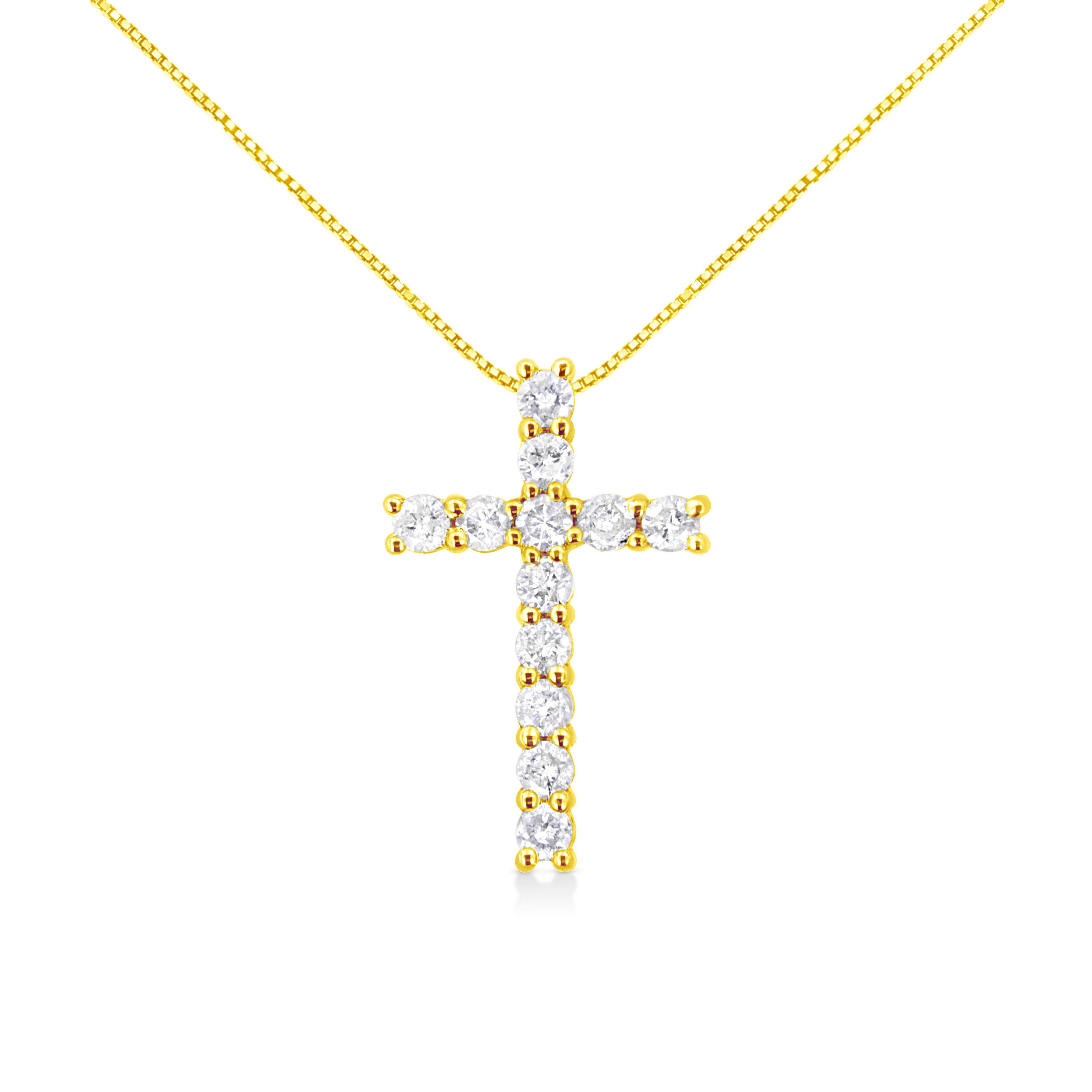 Faith meets fashion in this graceful diamond cross pendant. Crafted in warm 10k yellow gold plated .925 sterling silver, this feminine style crosses two single rows of shimmering prong-set diamonds to create an elegant design. Inspiring with 12